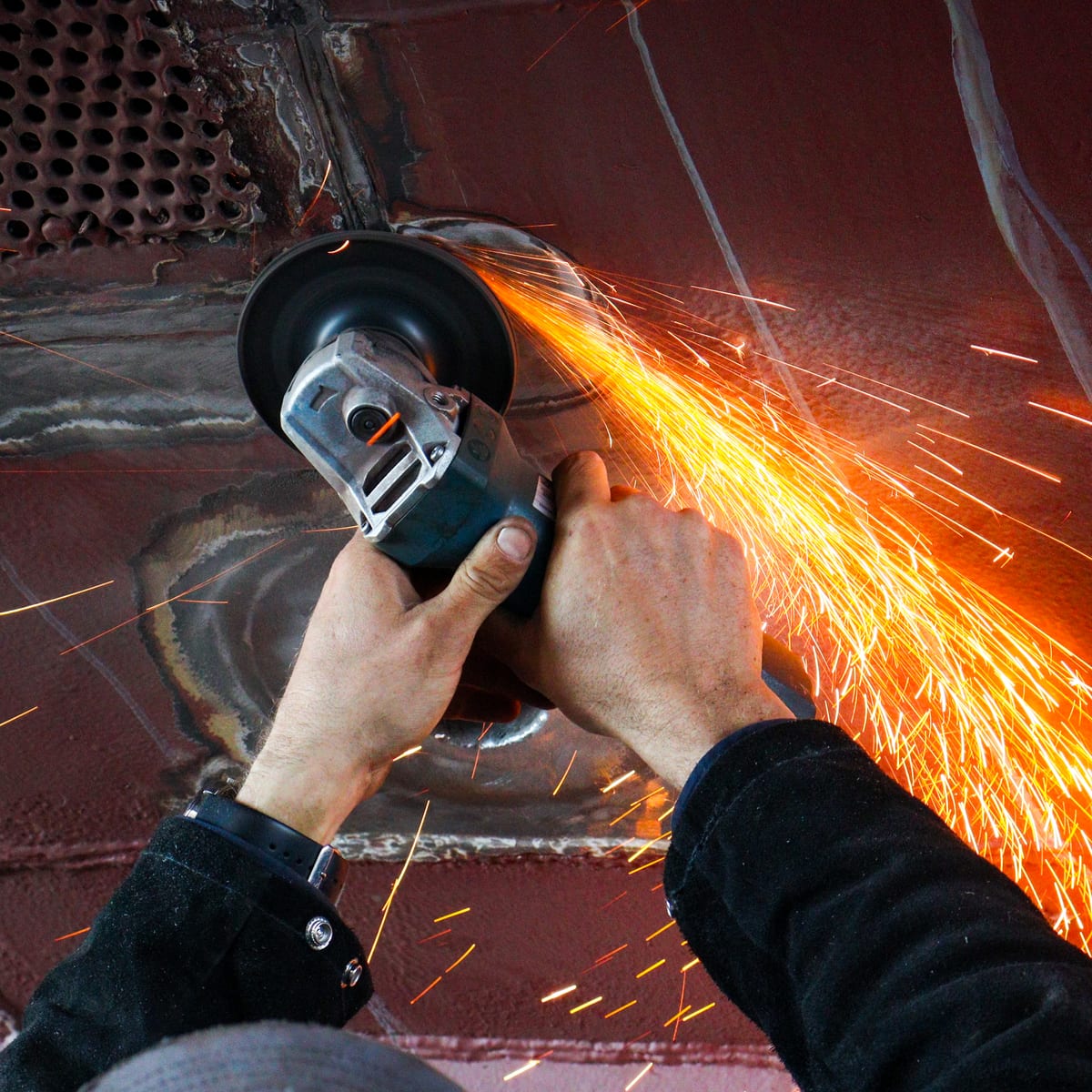 Grinding and finishing a weld on a boat hull